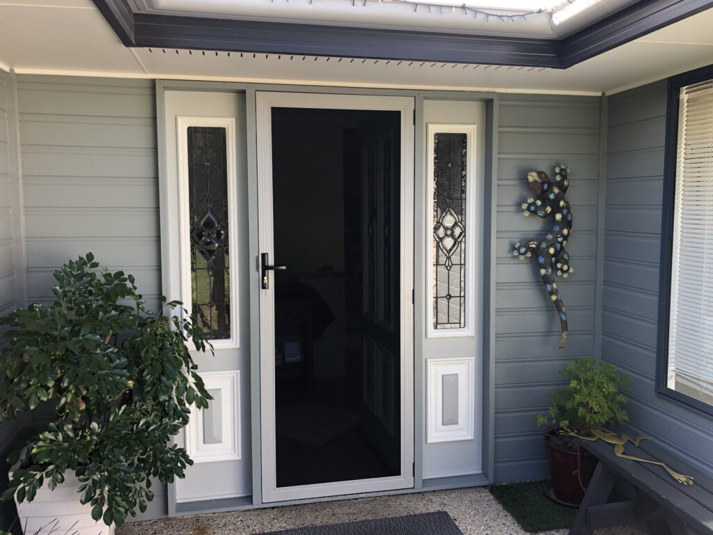 SecureView security door complementing a decorative front entry in Bli Bli