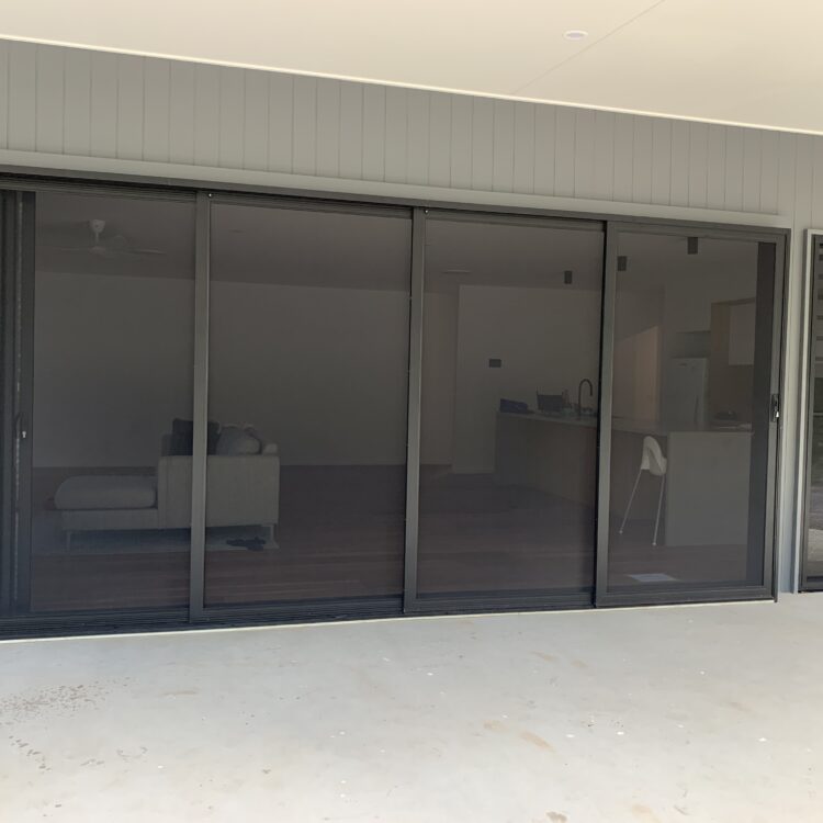 Four-panel SecureView stacking security doors on a modern Sunshine Coast home