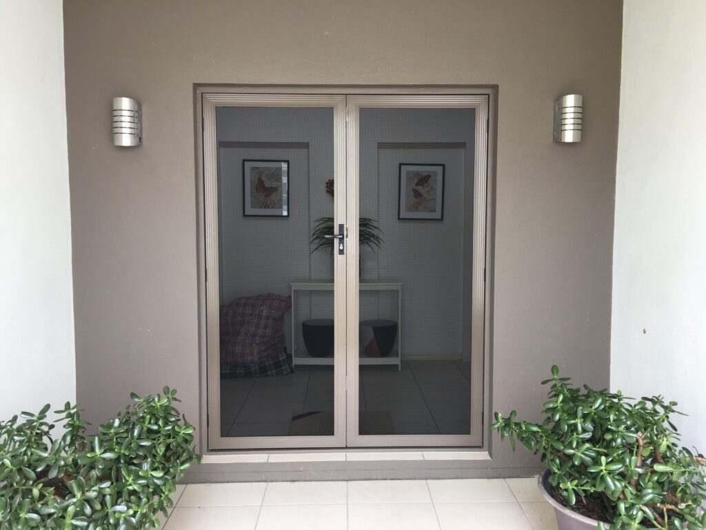 Double SecureView security doors matched to a contemporary neutral-coloured entry